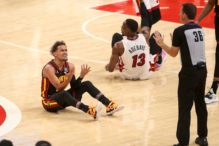 Atlanta Hawks guard Trae Young reacts to a foul during a game against Miami Heat.